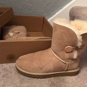Sand UGG with button. Gently used